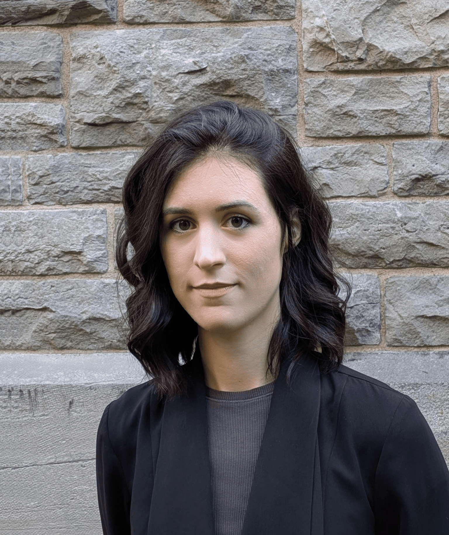 A headshot of Dr. Alexa Keeshan wearing a black blazer.