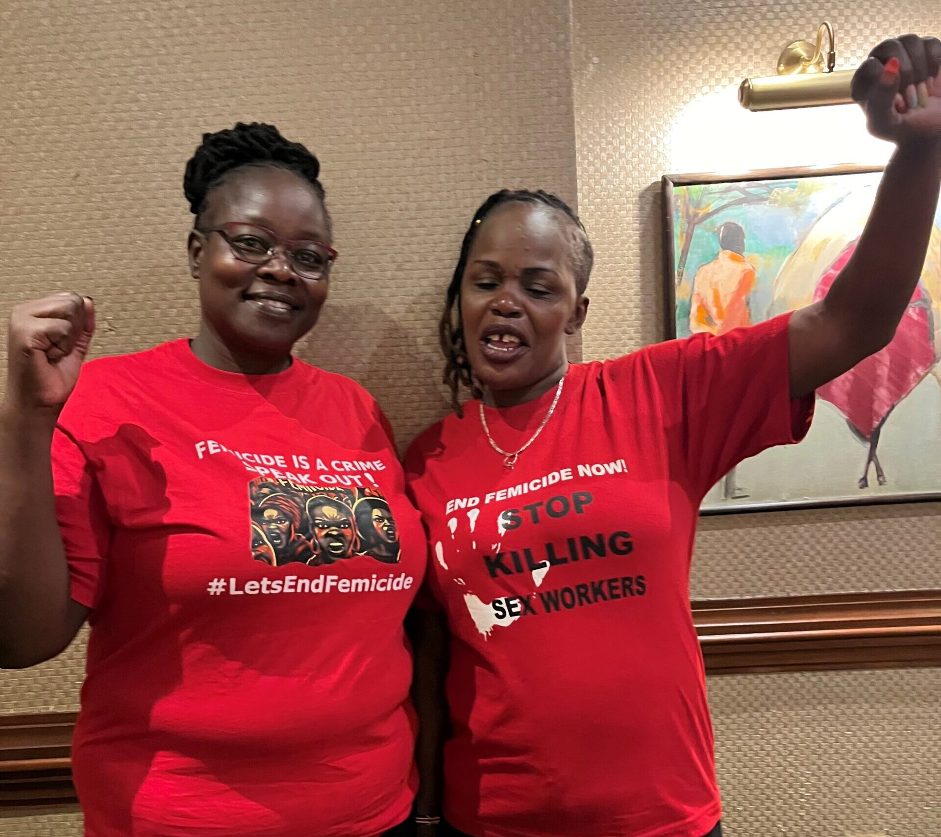 Joyce Adhiambo (left) and Veronica Were (right), wearing shirts to raise awareness about the killings of sex workers in Nairobi, Kenya. 